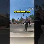 Police officer chasing running dog on street