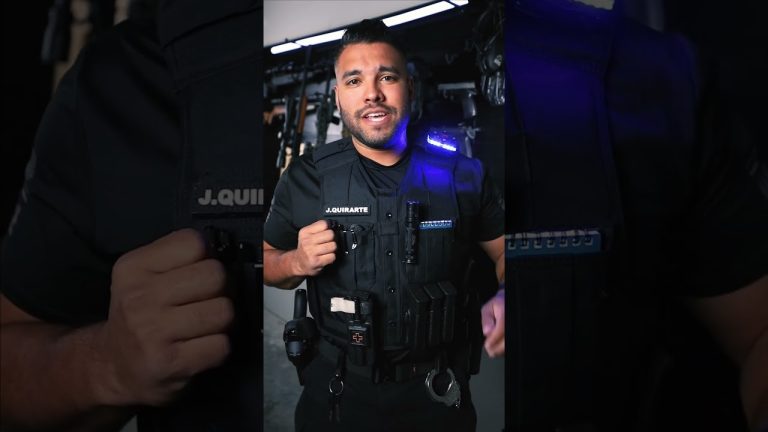 Person wearing tactical gear with equipment.