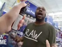 Person in store with spray can, Walmart signs visible.