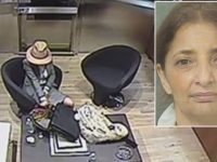 Surveillance image of woman seated in office.