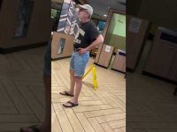 Man in casual clothes at a fast-food restaurant.