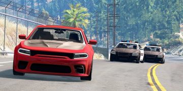 Red car chased by two police cars on road.