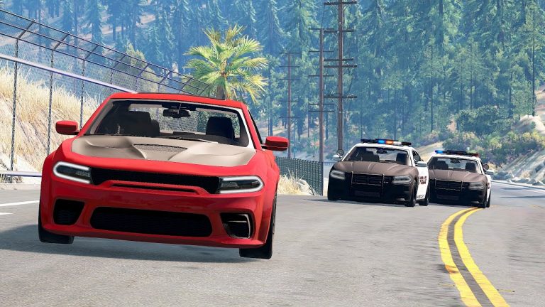 Red car chased by two police cars on road.