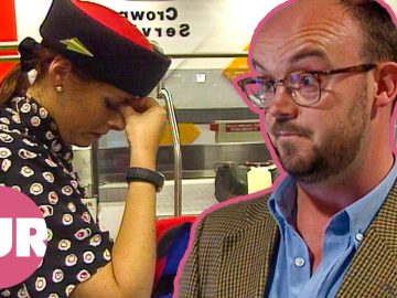 Airport worker looking stressed at counter