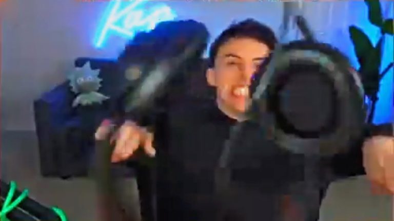 Person excitedly holding VR headset indoors.