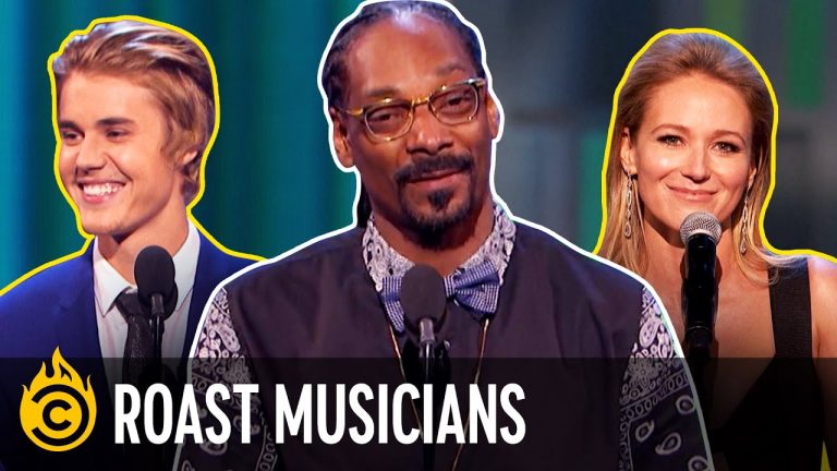 Three musicians smiling at comedy roast event.