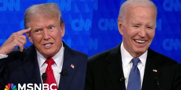 Two men in suits on TV debate screen.