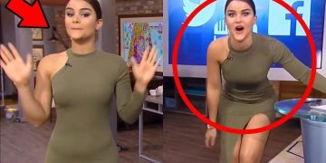 Woman in green dress on TV show set