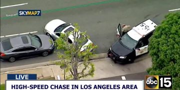 Police vehicle at car chase scene, Los Angeles