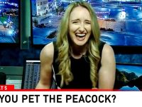 Laughing woman in news studio with street cameras.