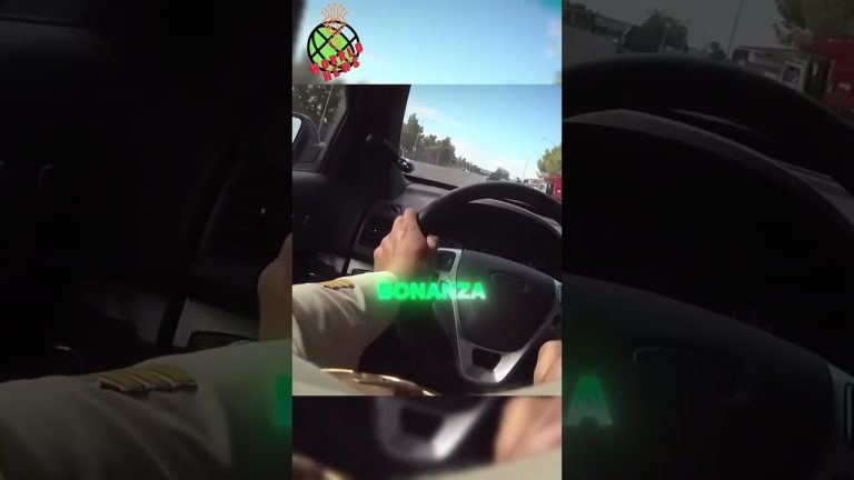 Person driving car on highway, steering wheel view.