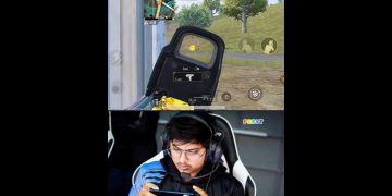 Person playing mobile shooting game with focus