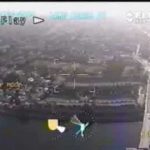 Aerial video footage of urban landscape with roads.