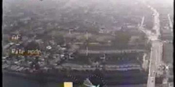 Aerial video footage of urban landscape with roads.