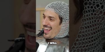 Person laughing in chainmail armor.