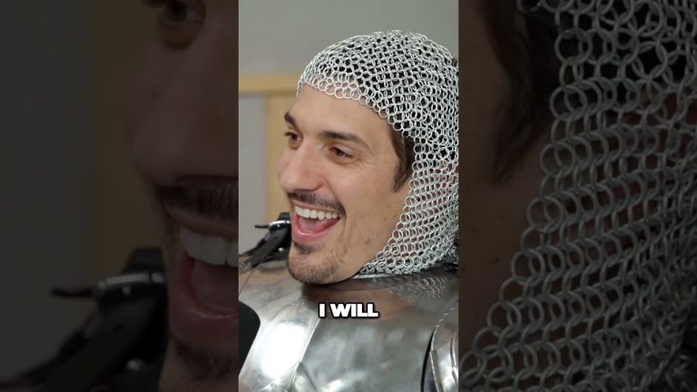 Person laughing in chainmail armor.