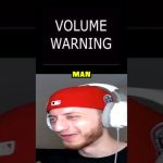 Man wearing headphones with volume warning sign