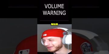 Man wearing headphones with volume warning sign