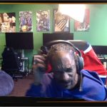 Person in gaming room with art in the background