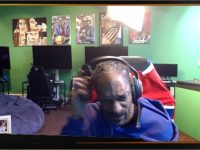 Person in gaming room with art in the background