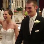 Joyful couple celebrating wedding in church