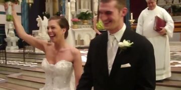 Joyful couple celebrating wedding in church