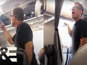 Passenger arguing on airplane near luggage compartment.