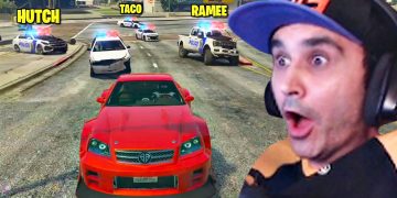 Excited gamer in car chase with police in game.