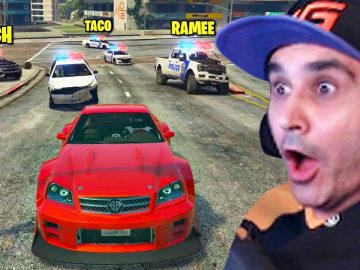 Excited gamer in car chase with police in game.