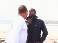 Two men arguing on a beach