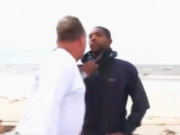 Two men arguing on a beach