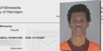 Mugshot overlayed on a legal document.
