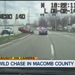 Police car chase on road, Macomb County.