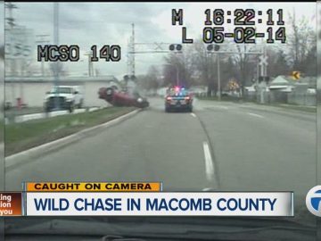Police car chase on road, Macomb County.