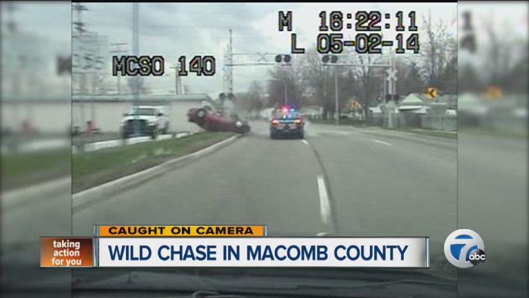 Police car chase on road, Macomb County.