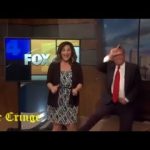 News anchors dancing in studio, humorous moment