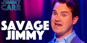 Comedian on stage with expressive face, Savage Jimmy