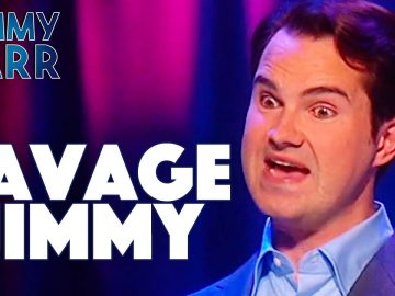 Comedian on stage with expressive face, Savage Jimmy
