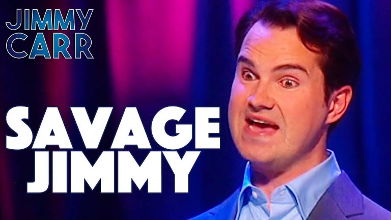 Comedian on stage with expressive face, Savage Jimmy