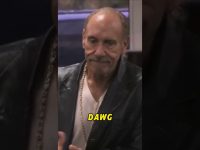 Man in leather jacket with 'DAWG' text