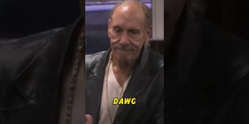 Man in leather jacket with 'DAWG' text