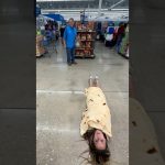 Woman wrapped in tortilla blanket in store aisle