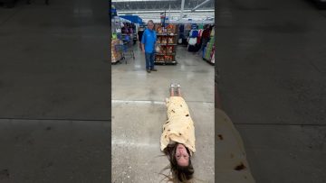 Woman wrapped in tortilla blanket in store aisle