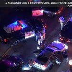 Police cars and officers at night traffic stop.