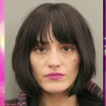 Woman with dark hair and pink lipstick