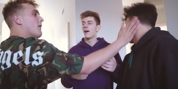 Three friends interacting playfully indoors