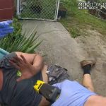 Person on ground with taser, police interaction.