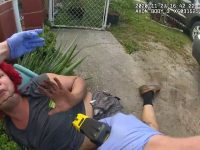 Person on ground with taser, police interaction.