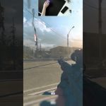 Gamer playing FPS, sniper rifle aiming on road.