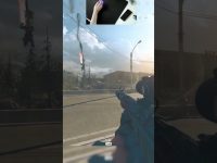 Gamer playing FPS, sniper rifle aiming on road.